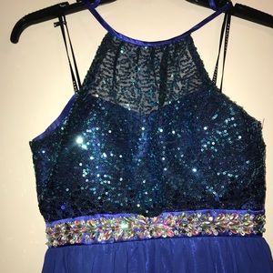 Selling a beautiful long dark blue dress.